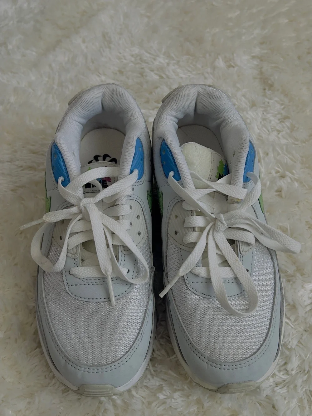 Nike Air Max 90 sneakers in white with blue and green accents